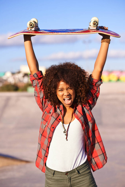 Portrait, fashion and excited black woman with skateboard in city for exercise, training and skating in skatepark. Skater, shouting and face of female person for trendy, edgy and hipster clothing. - Foto, Bild
