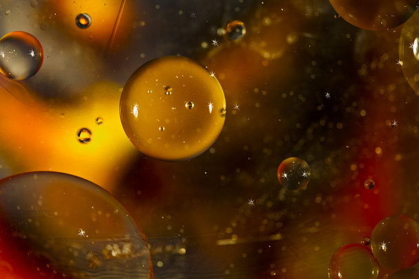 Oil on water outer space design background - Foto, Bild