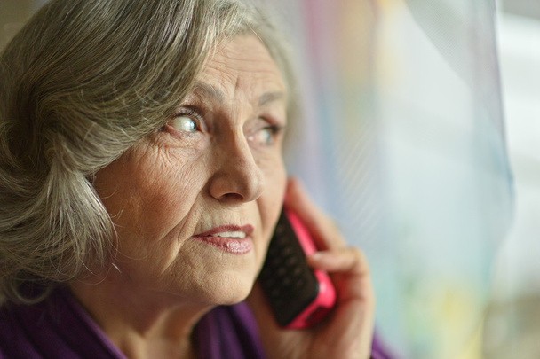 Senior woman with mobile phone - Photo, image
