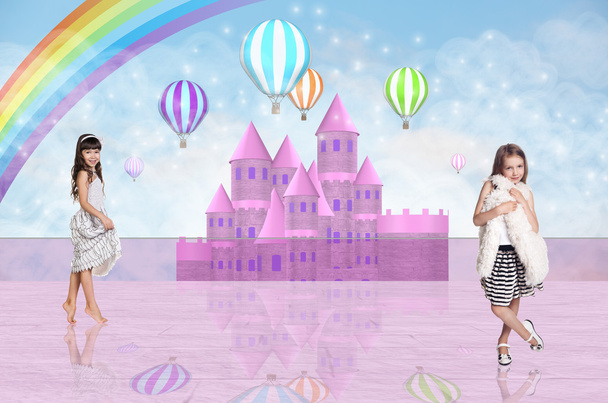 Two little girl in front of a pink fairy castle - Photo, Image