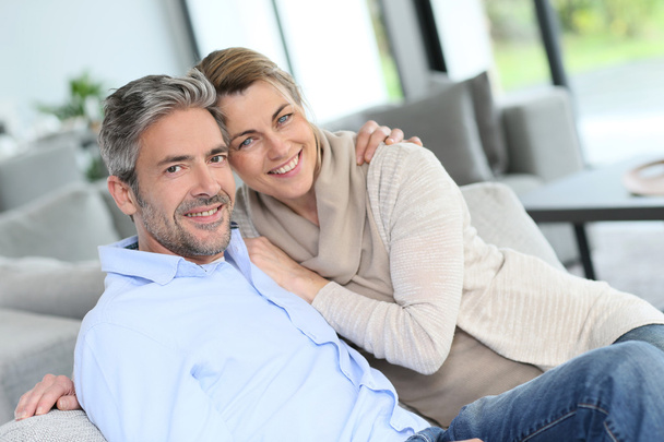 Couple relaxing at home - Foto, Bild