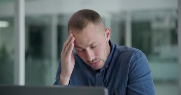 Business, headache and man with burnout, pain and frustrated with project and anxiety in a workplace. Person, modern office or consultant with laptop or migraine with stress, medical issue or fatigue. - Footage, Video