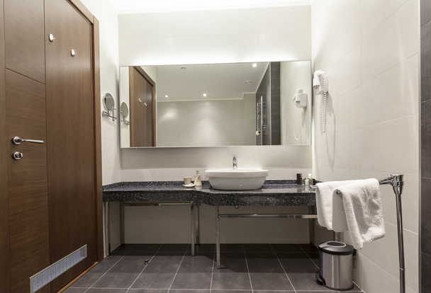Sink and mirror in hotel bathroom - Photo, image