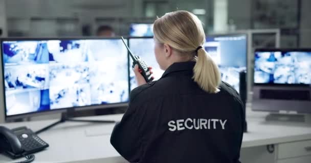 Woman, security and talking with computer and radio, female person and protection technology in office. Communication, surveillance on monitor for information, screen for safety and walkie talkie. - Footage, Video