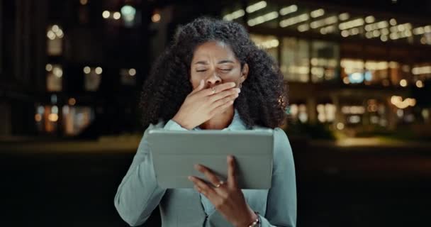 Tablet, yawn and tired business woman in city at night with low energy, exhausted or bored. Digital, search and female worker with burnout, fatigue or sleepy while reading client feedback or review. - Footage, Video