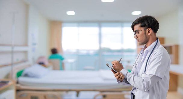 Doctor with stethoscope in the hospital. Healthcare and Medicine concept - Photo, Image