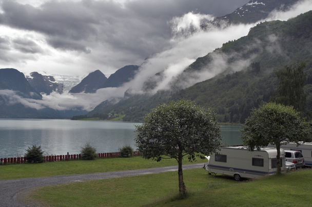 Camping by the mountain lake with mountains and glacier at backg - Фото, зображення