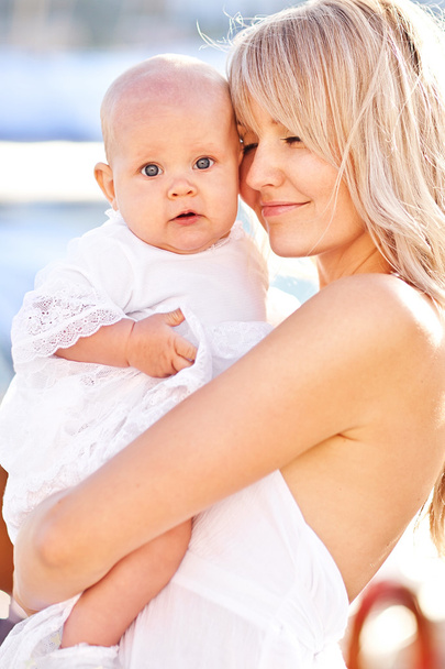 Mother and baby in yacht club - Photo, Image