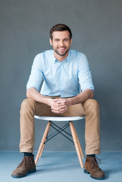 Handsome man sitting on chair - Photo, Image