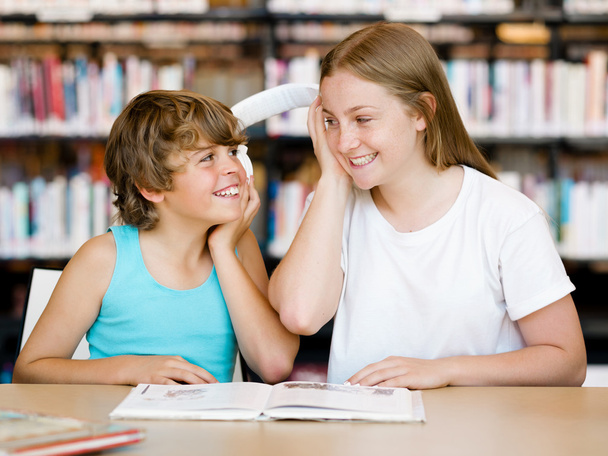 Teenage girl and her brother with books - Foto, imagen