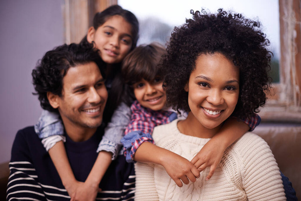 Parents, children and family portrait on couch with smile connection with comfort, support or love. Mother, father and siblings face in living room for youth development or casual, holiday or care. - Photo, Image