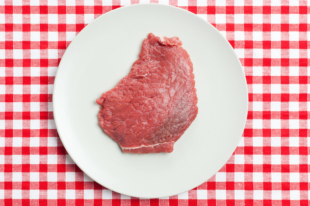 Raw beef steak on plate - Foto, imagen