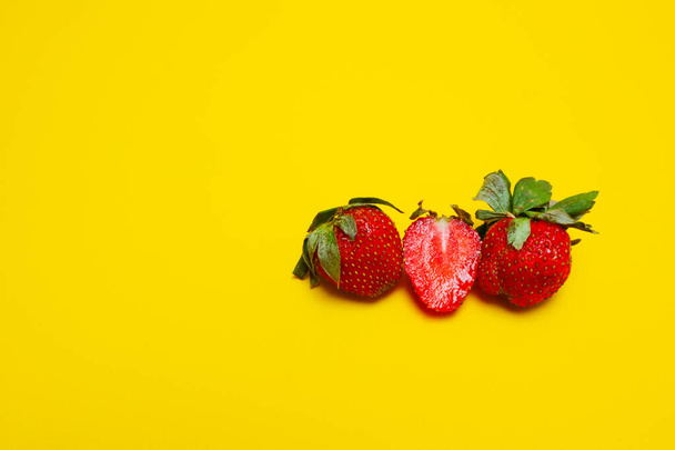 photo of strawberries isolated on yellow background - Foto, imagen