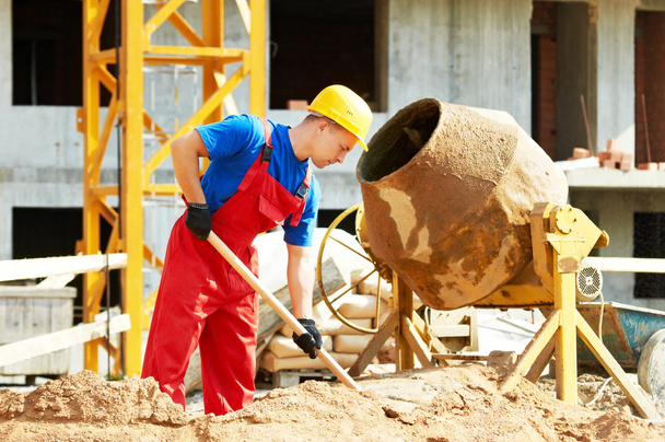 builder worker at construction with mixer - Fotoğraf, Görsel
