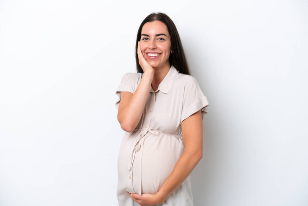 白人の背景に孤立した若い白人女性妊娠中で幸せ - 写真・画像