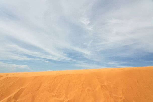 Sand dune in the desert with clouds in the background - Photo, Image