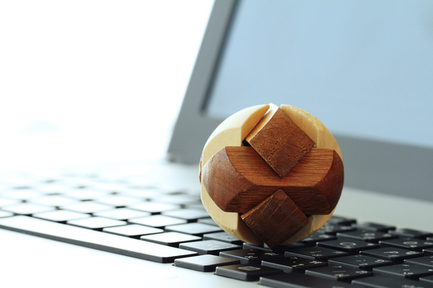 wooden texture globe with social media diagram on laptop compute - Foto, imagen