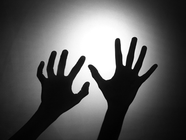Silhouette von zwei Händen - Foto, Bild