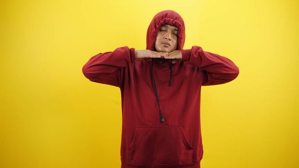 portrait of asian man in hoodie showing stop gesture - Photo, Image