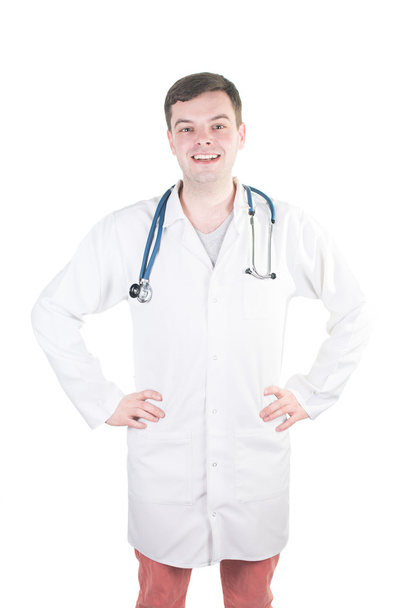 Portrait of confident young medical doctor on isolated background - Foto, imagen