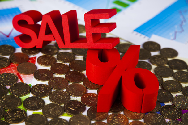 Sale sign on heap of coins - Photo, Image