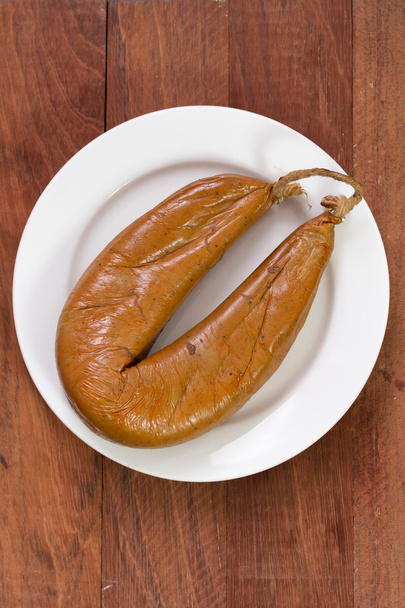 Smoked sausage on plate - Foto, afbeelding