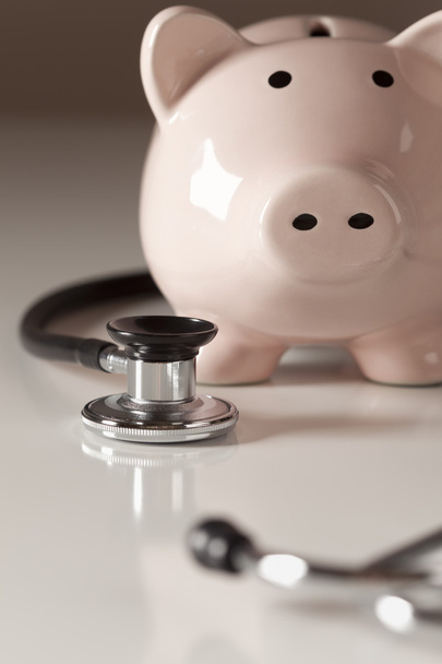 Piggy Bank and Stethoscope with Selective Focus - Foto, Bild
