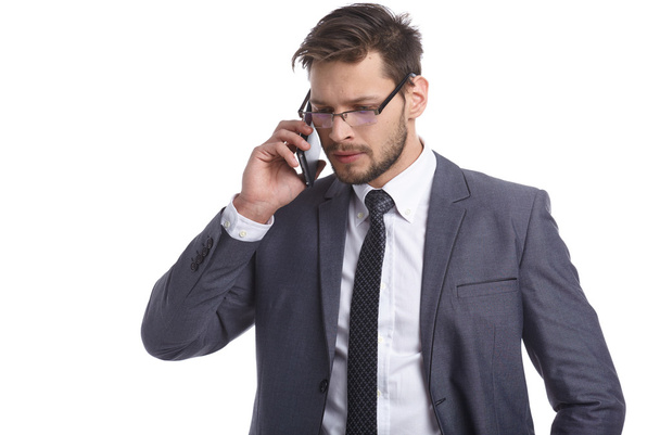 Businessman nervously talking on the phone - Фото, зображення