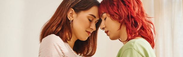banner of serene young lesbian couple with closed eyes standing next to each other, bliss and love - Foto, Imagem