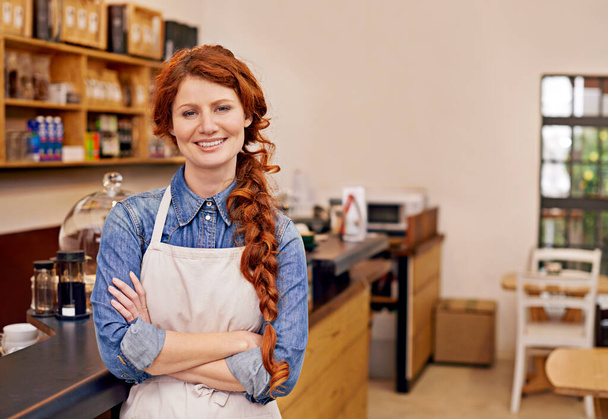 Barista, woman and arms crossed in portrait at cafe with smile, pride and entrepreneurship. Person, waitress or business owner at coffee shop with confidence for service, catering and job in Dublin. - Photo, Image