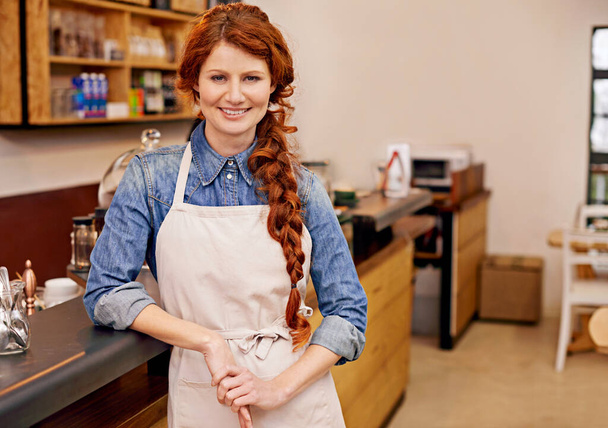 Barista, woman and happy in portrait at coffee shop for career, pride or entrepreneurship. Person, waitress or small business owner at cafe with confidence for service, catering and smile in Dublin. - Photo, Image