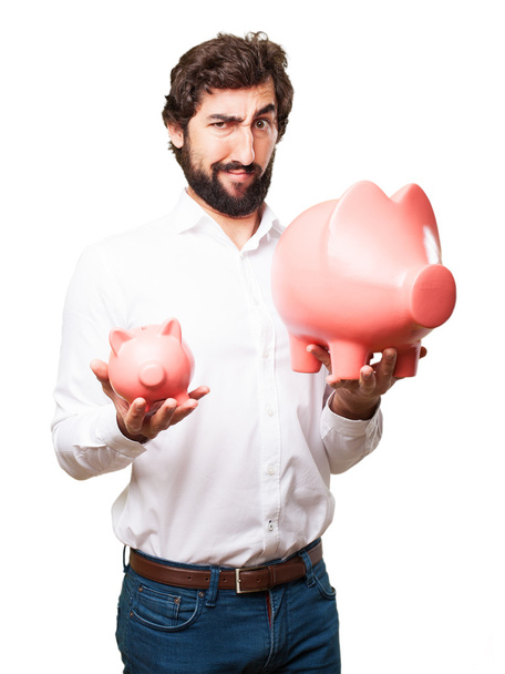 man with a piggy bank - Foto, afbeelding