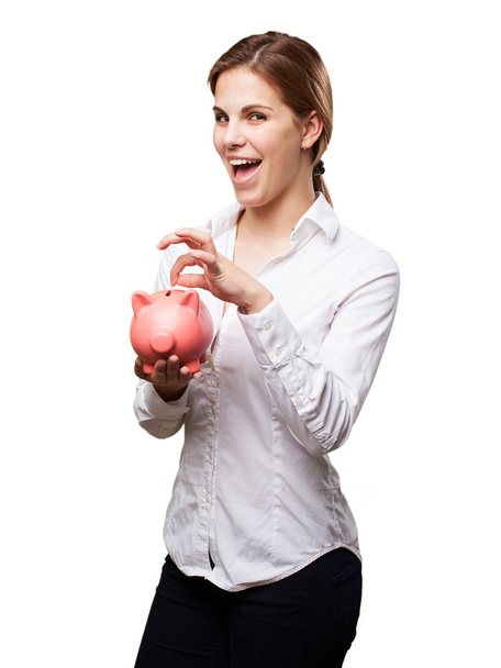 blond woman with a piggy bank - Foto, immagini