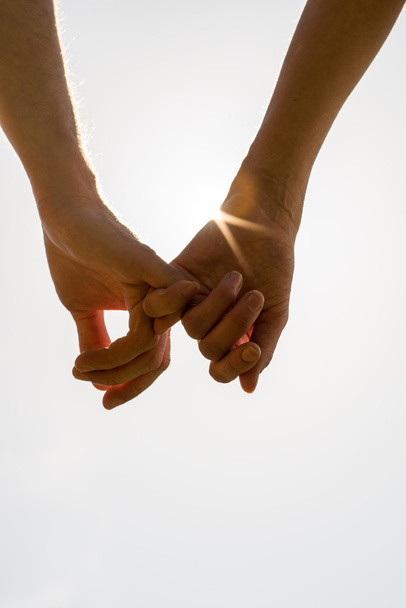 Romantic couple with clasped hands - Photo, Image
