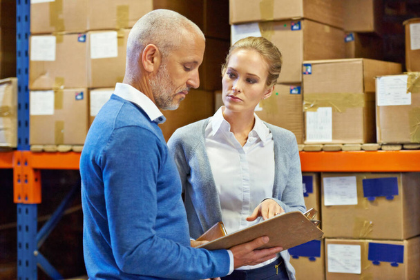 Logistics, team or clipboard in warehouse with inventory for quality control, service delivery or freight distribution. Senior manager, woman or wholesale supplier with stock checklist for inspection. - Photo, Image