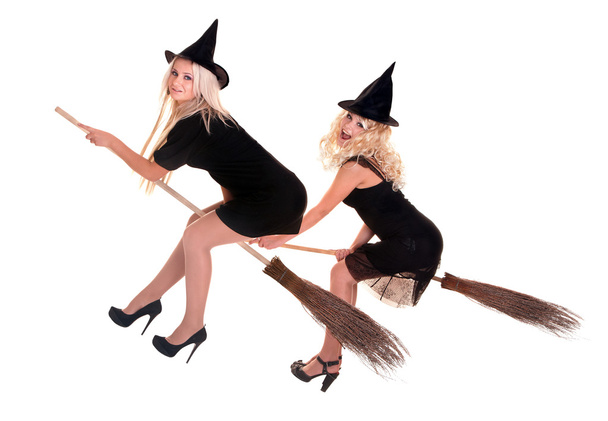 Group Halloween witch blond in black hat fly on broom. - Photo, Image