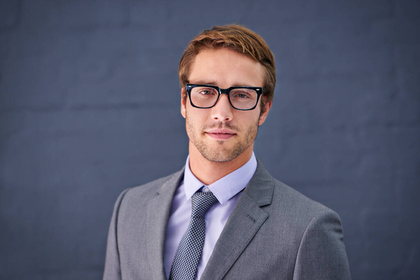 Caucasian, man and business with glasses in studio for paralegal work, clerk or assistant or counsel. Businessman and spectacles on backdrop for legal profession, associate attorney or barrister. - Photo, Image