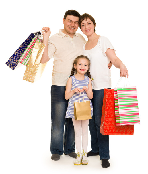 gelukkige familie met boodschappentas - Foto, afbeelding