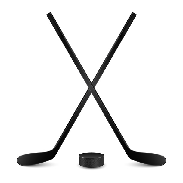 Two crossed hockey sticks and puck. Isolated on white - Вектор, зображення