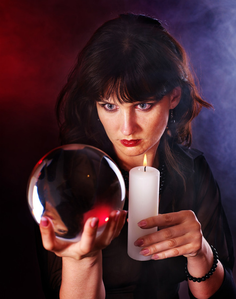 Young woman with crystal ball. - Φωτογραφία, εικόνα