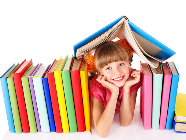 Child reading open book on table. - Φωτογραφία, εικόνα