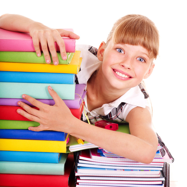 School child holding stack of books. - Foto, afbeelding