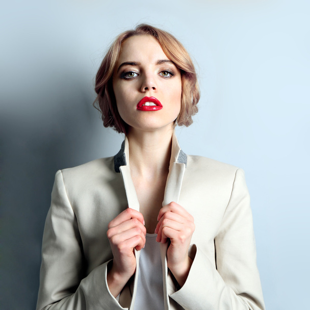 Portrait of expressive young model on light blue background - Foto, Imagem