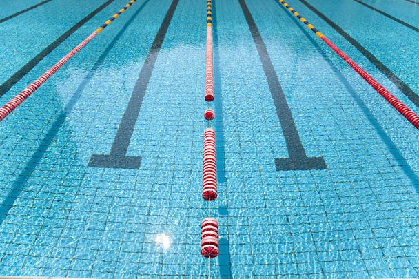 Blue line of lane in clear swimming pool - Foto, imagen