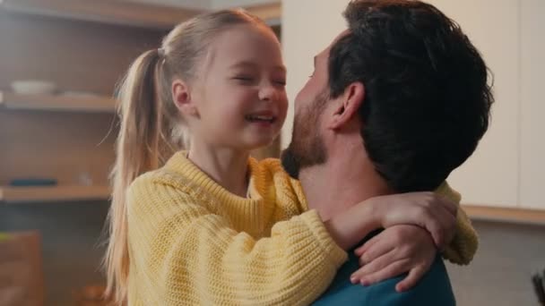 Adorable smiling happy daughter cuddle caring lovely daddy dad hug custody adoption love bond close up touch noses fooling playing game closeness together father with kid child girl hugging family - Footage, Video