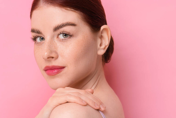 Portrait of beautiful woman on pink background, closeup. Space for text - Fotoğraf, Görsel