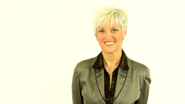Business middle aged woman smiles - white background - studio - Footage, Video