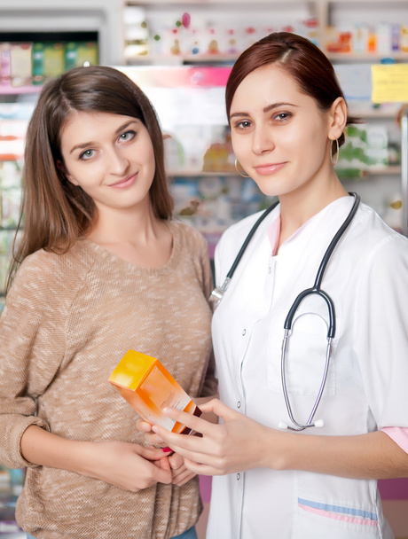 Woman doctor and client inside pharmacy - Fotoğraf, Görsel
