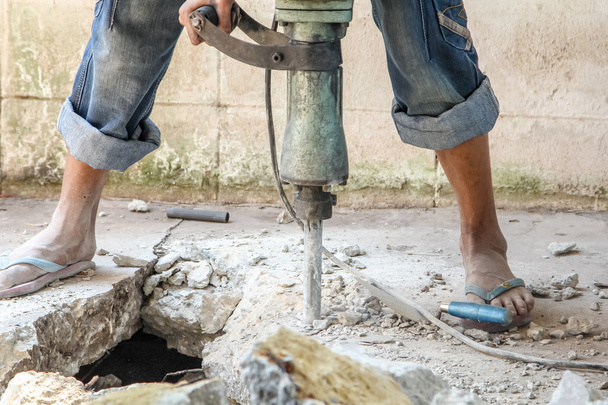 Budowniczy pracownika z Wiertarka udarowa pneumatyczna - Zdjęcie, obraz