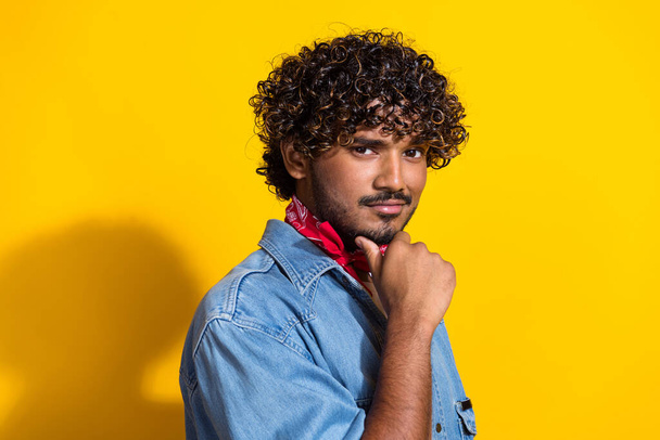Photo portrait of nice young male touch chin confident model dressed stylish denim outfit red scarf isolated on yellow color background. - Φωτογραφία, εικόνα